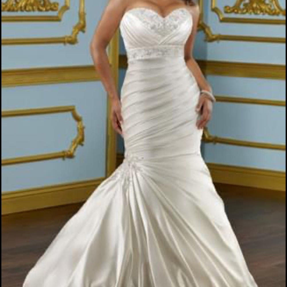 Beautiful original gown purchased from
Bridal boutique and preserved.